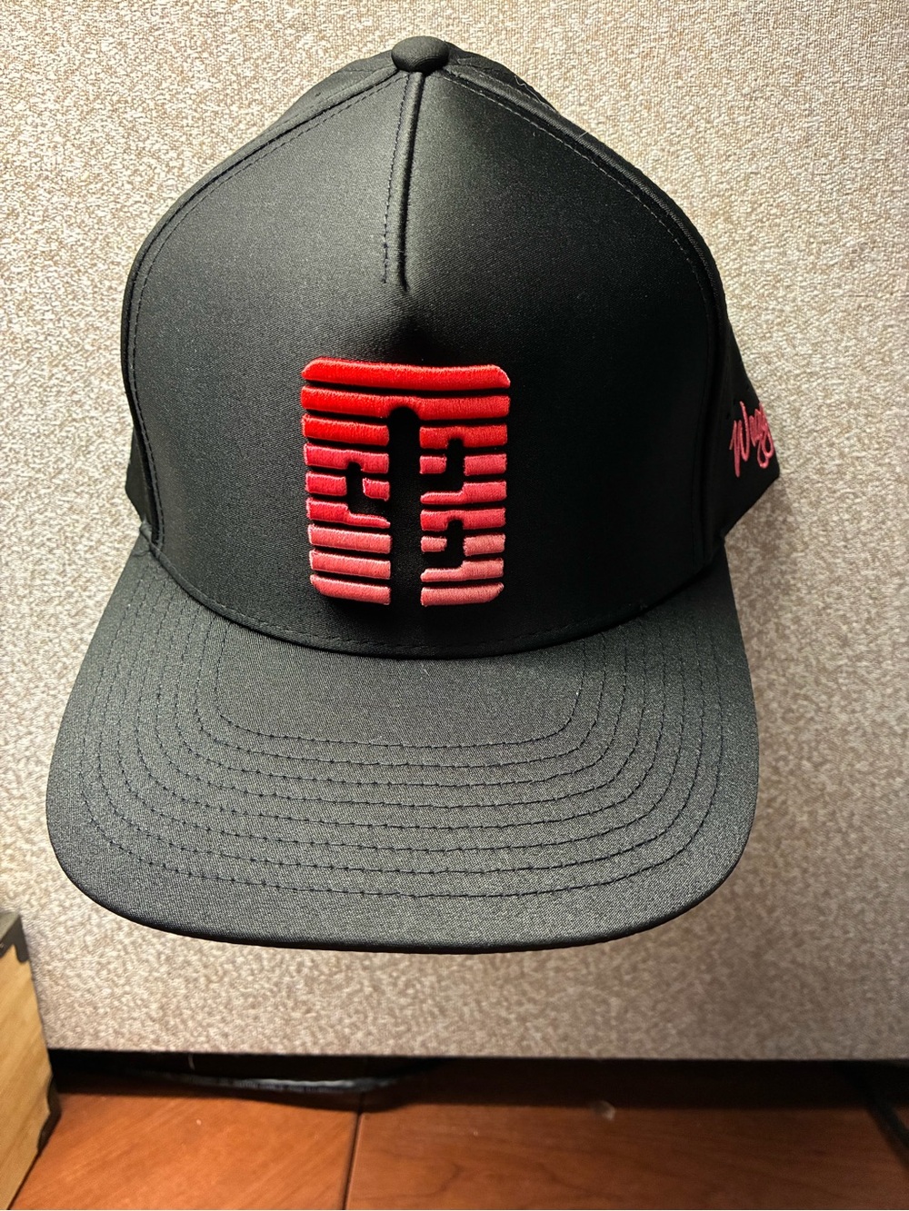 Black Snapback Hat with Red Embroidered Front Emblem